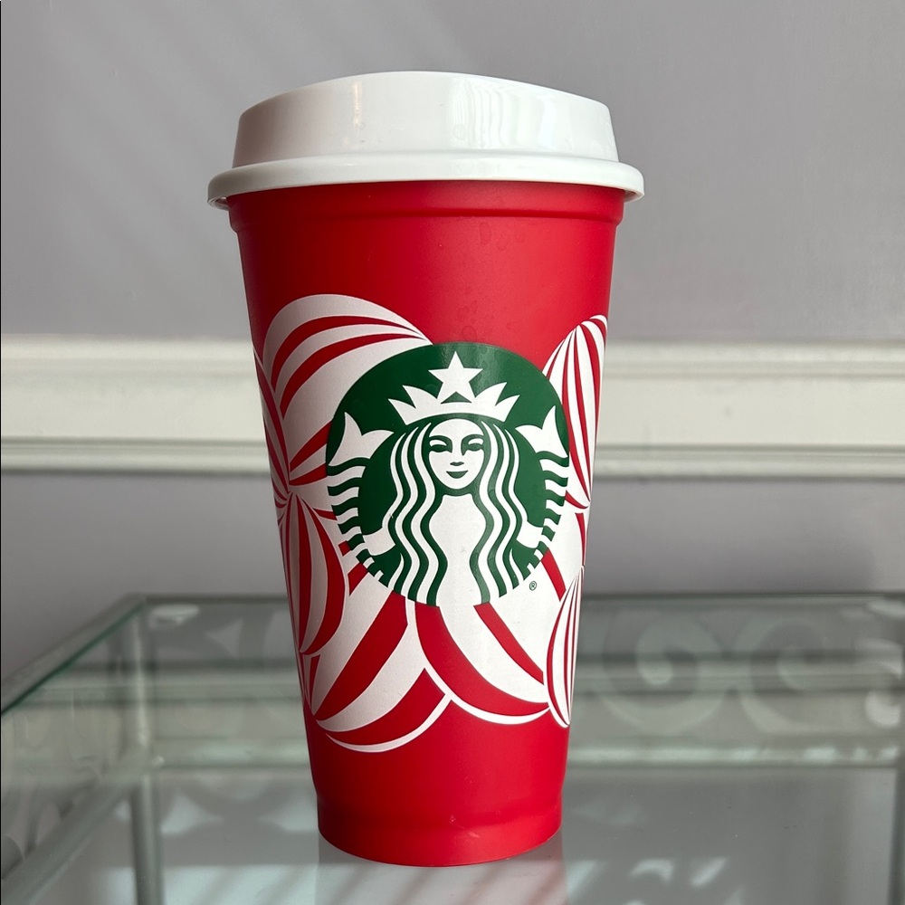 Starbucks 16 oz collectible Red Cup Holiday 2024 with peppermint candy design